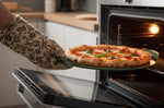 Plat à pizza Cookut Le Formidable fougère avec coupe-pizza et livret de recettes