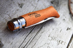 Couteau Opinel Tradition Carbone n°10 lame 10cm manche hêtre + virole tournante