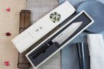 Couteau santoku japonais Kanetsugu Zuiun acier SPG2 damas 18cm