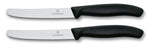 2 couteaux de table Victorinox noirs lames crantées 11cm bout rond