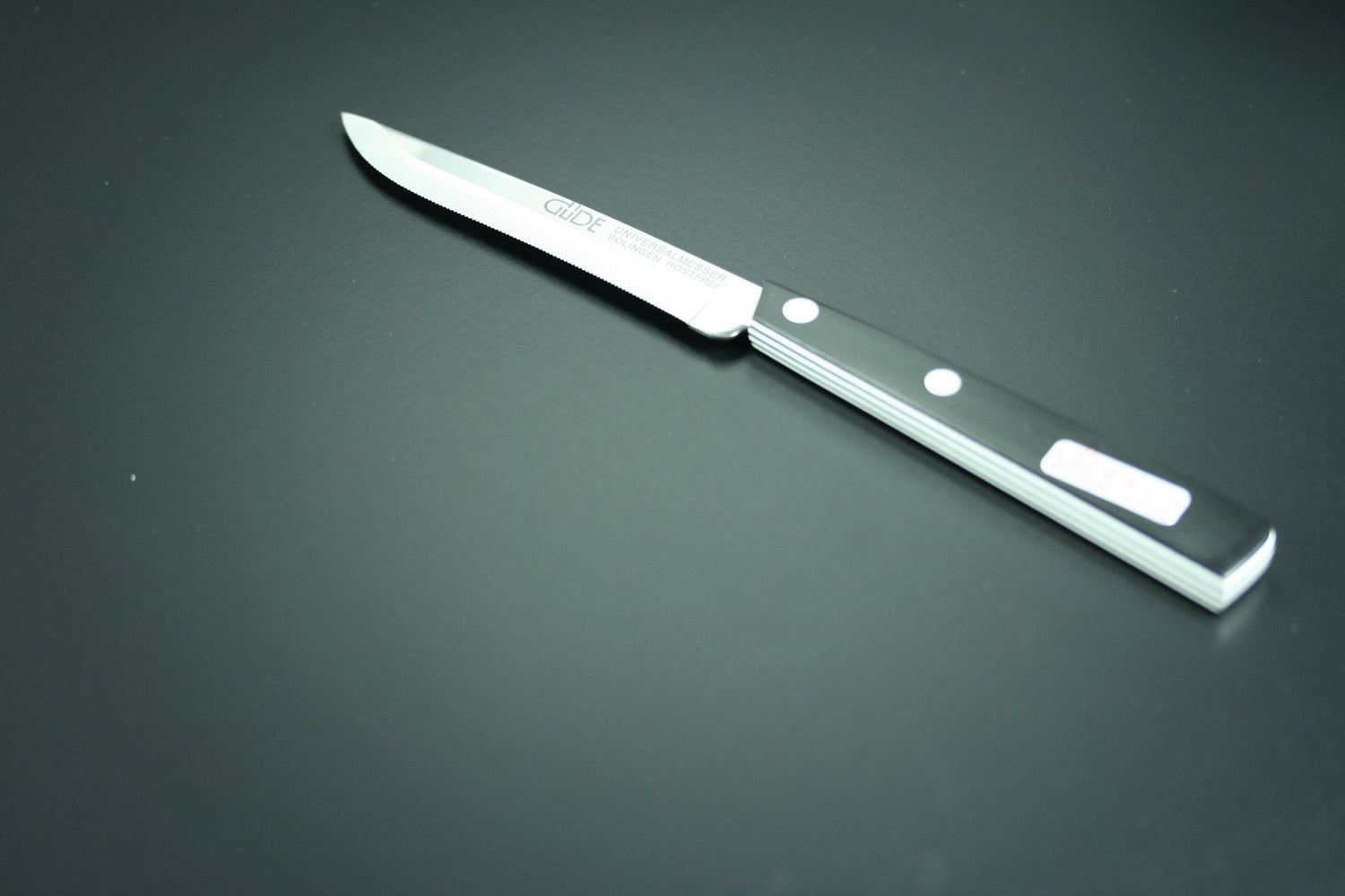 Couteau de table GÜDE Universel 10cm micro-denté manche noir/blanc